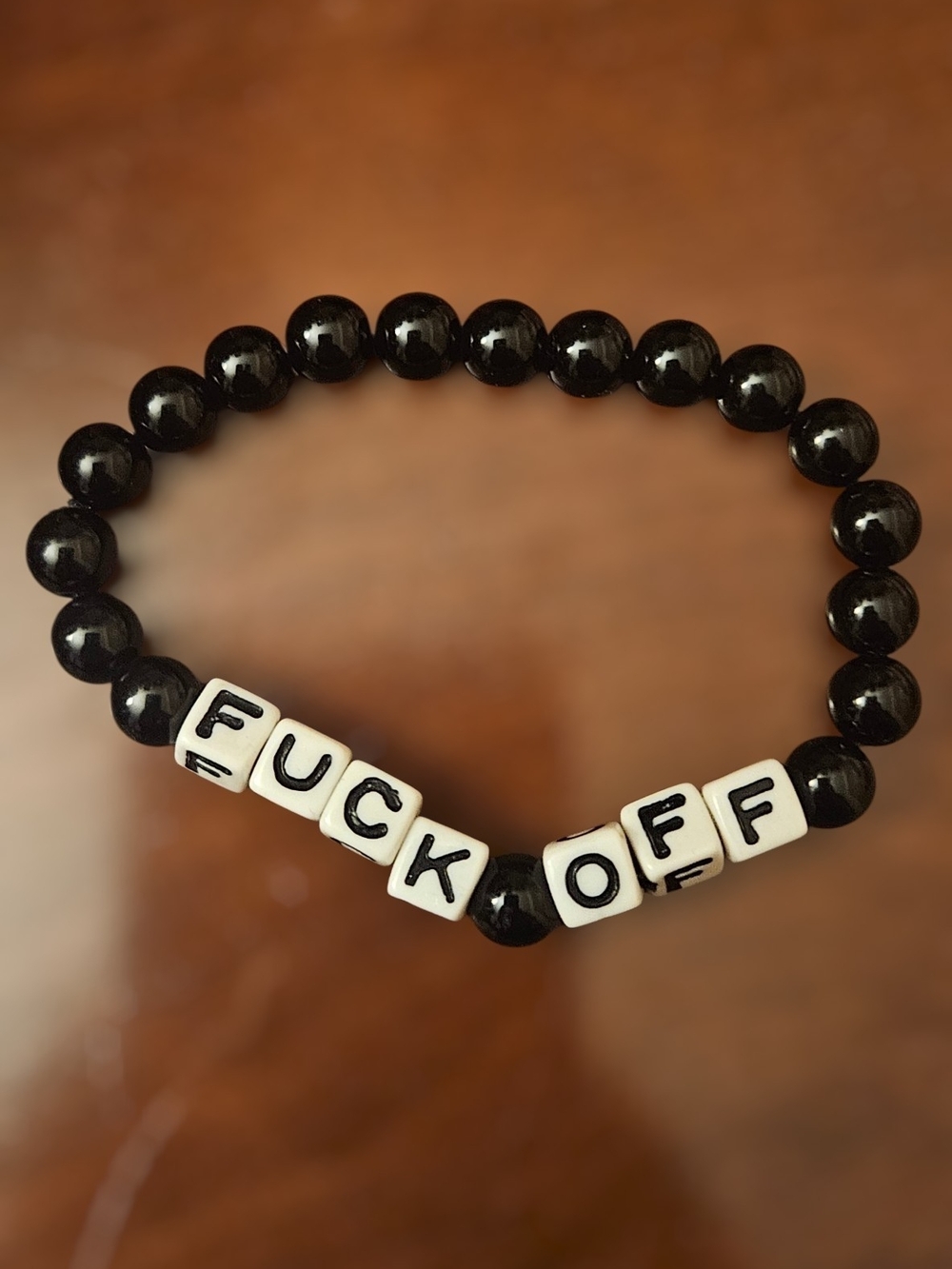 Spencer's Black Beaded Bracelet with White Letter Beads